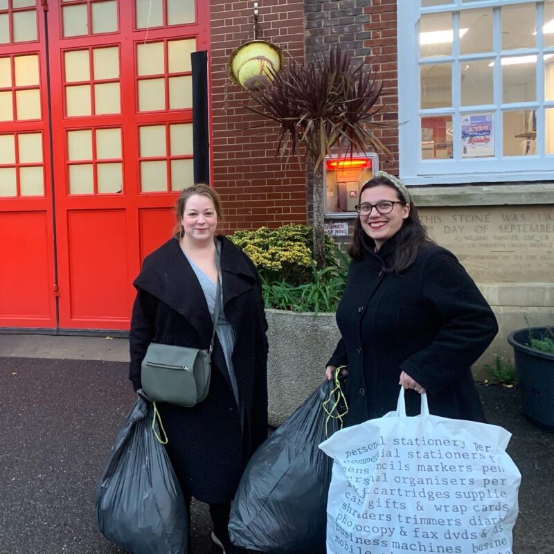 Kingston Labour Chair, Kezia Coleman, and Membership Officer, Naomi Bamford-Hurrell taking coats to Surbtion Fire Station 